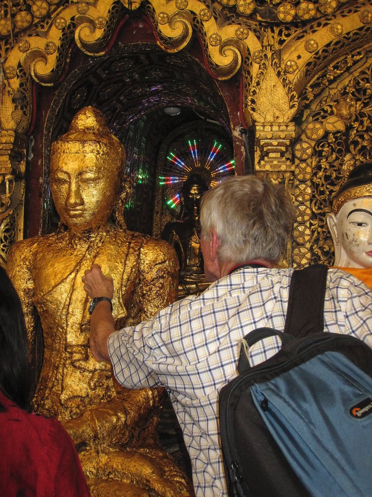 17-Pasting gold leave on the Buddha.jpg -                                